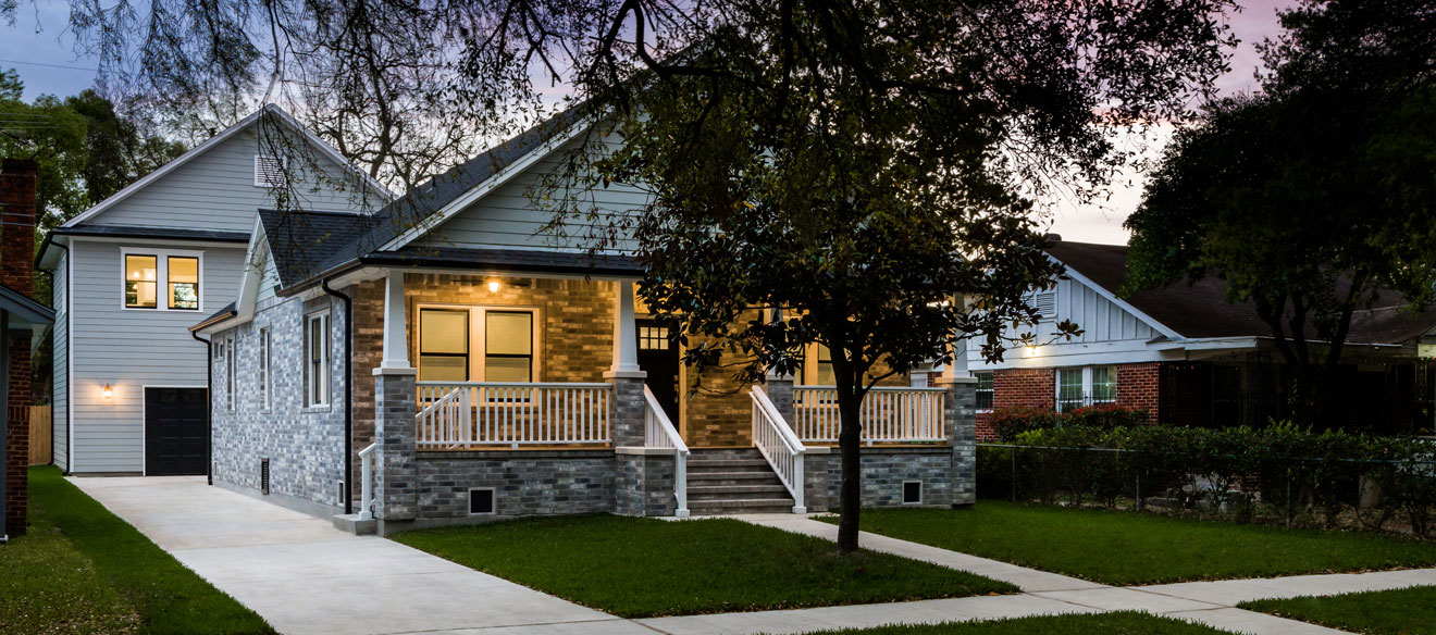 Ranch style home with a two story garage in the back. A garage apartment is on the second floor. 