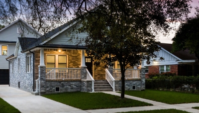 Ranch style home with a two story garage in the back. A garage apartment is on the second floor. 