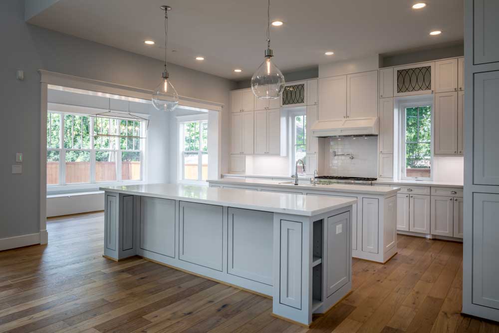 Custom kitchen with two islands and dining area in new home, Bellaire neighborhood, Houston