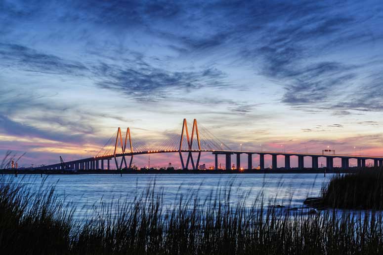 Fred Hartman Bridge in Houston, Texas. It is a cable-stayed bridge spanning the Houston Ship Channel. The bridge carries 2.6 miles (4.2 km) of State Highway 146 (SH 146), between the cities of Baytown and La Porte (east of Houston). 